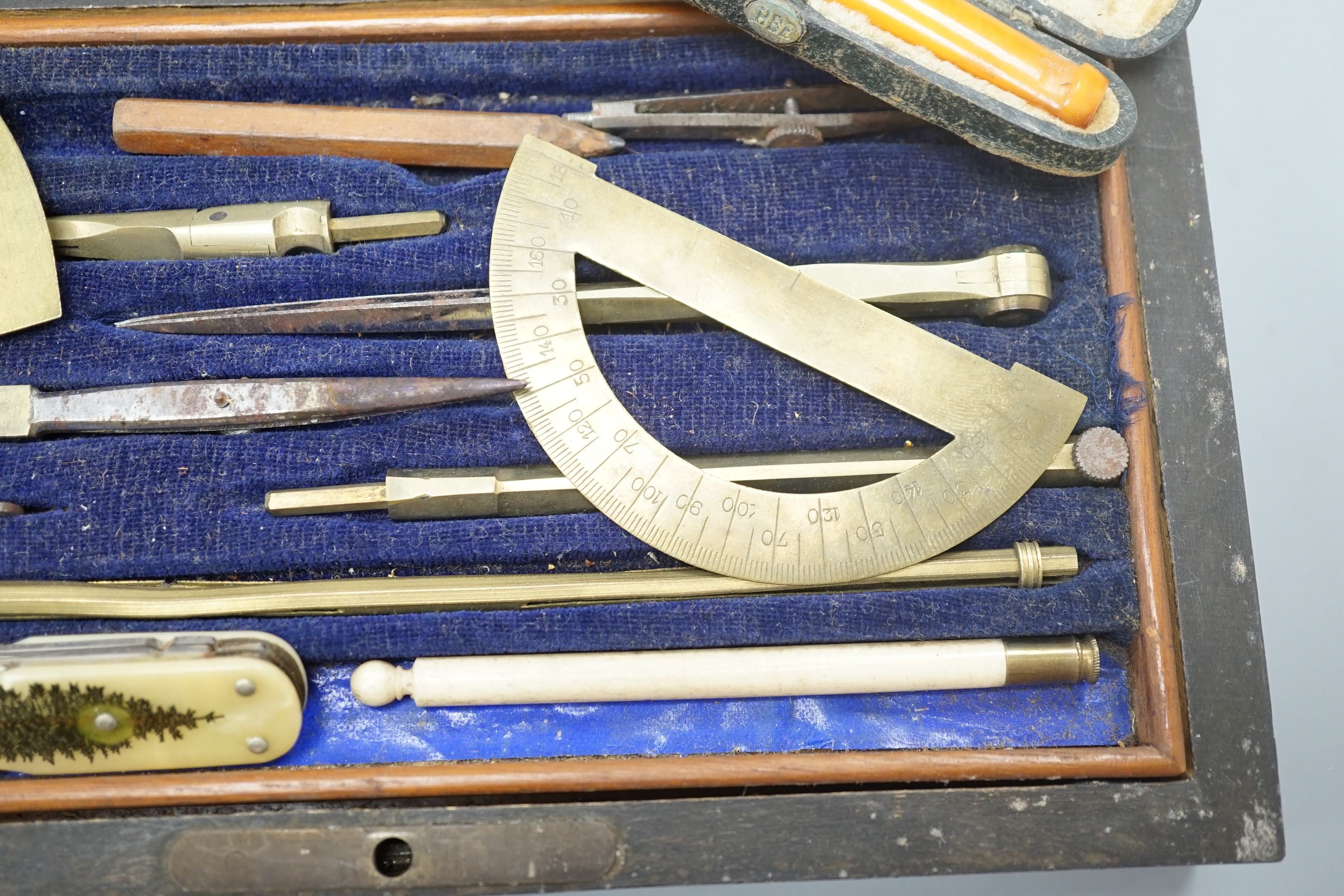 A Victorian draughtsman's set, a gold mounted amber cigar holder and a pocket knife, bone handle